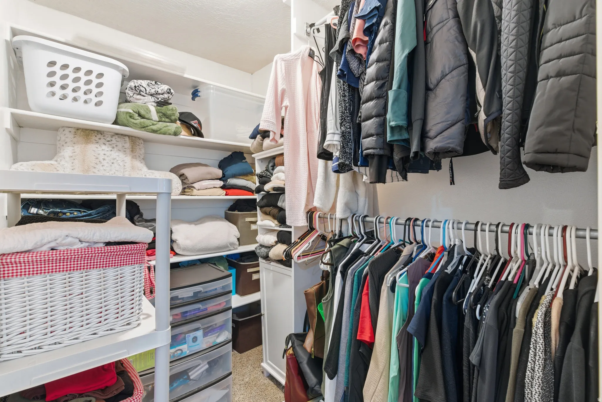 Primary bedroom walk-in closet
