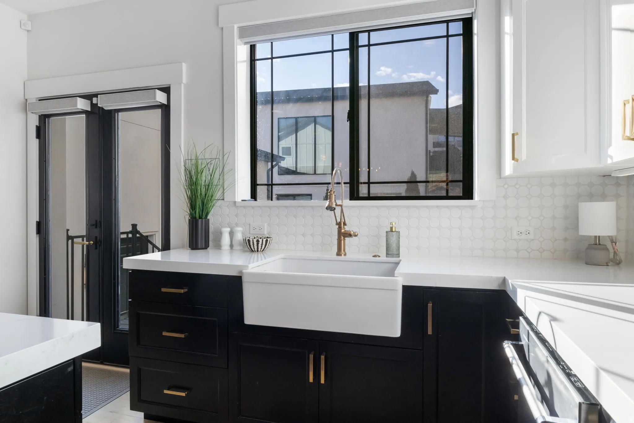 Full bathroom featuring vanity, tasteful backsplash, and french doors