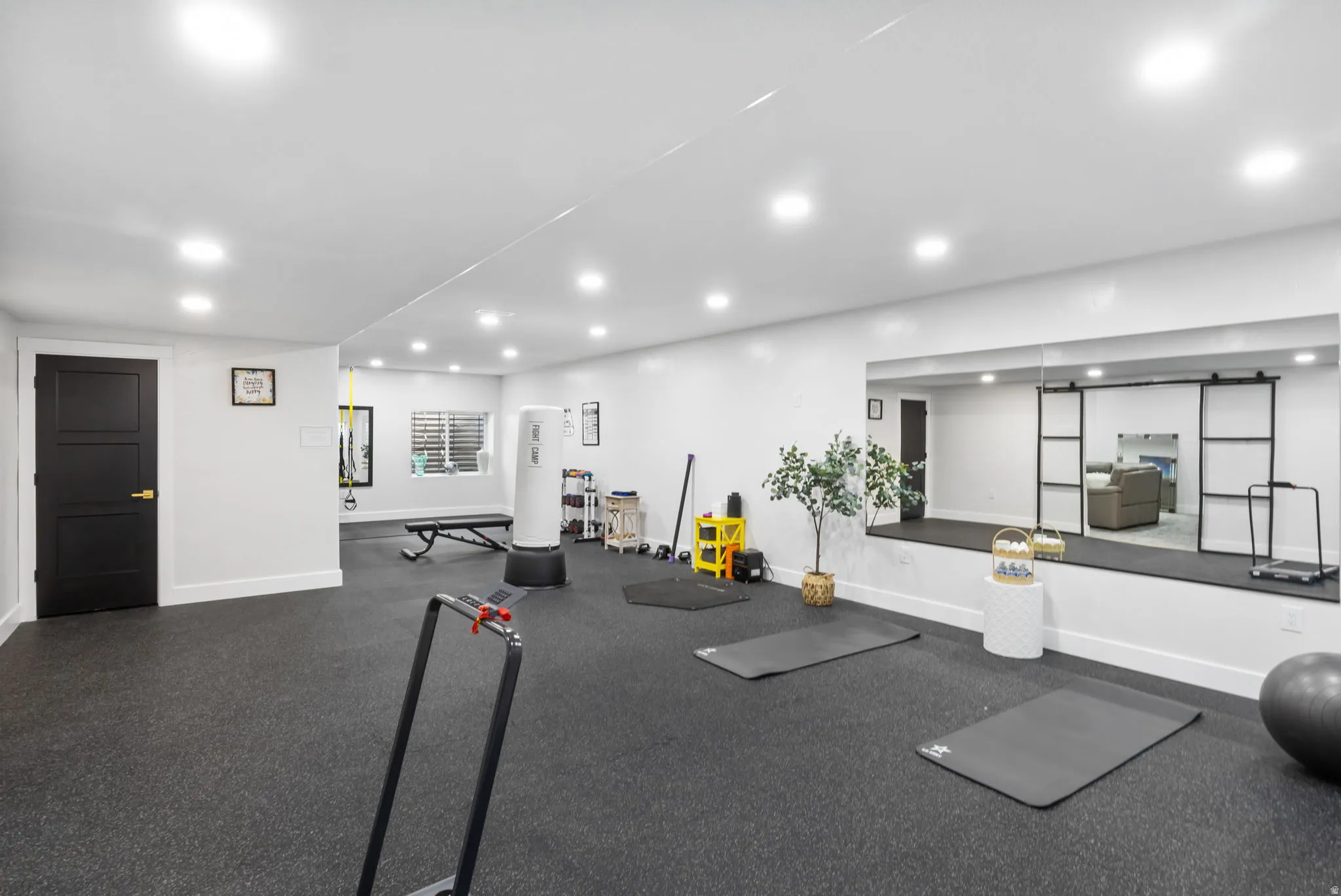 Exercise room featuring recessed lighting
