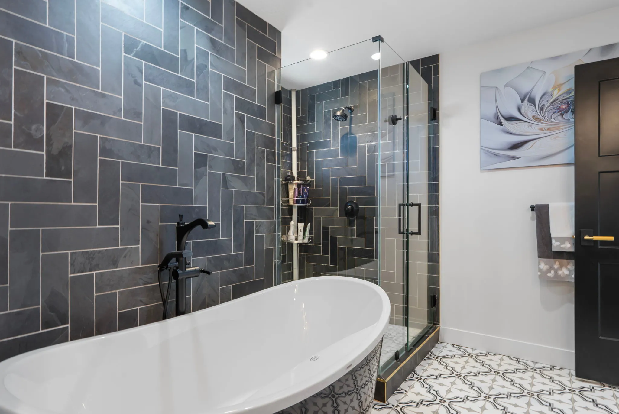 Full bathroom featuring a freestanding tub, tile patterned flooring, recessed lighting, and a shower stall