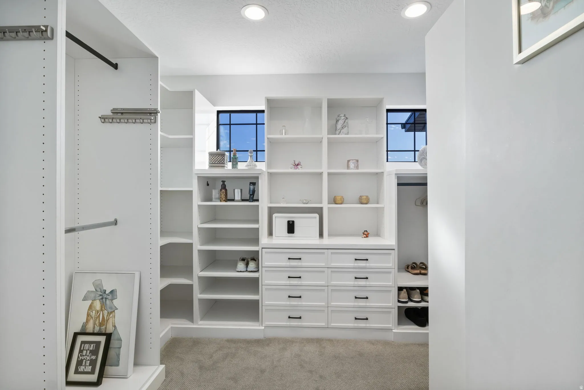 Spacious closet with light colored carpet