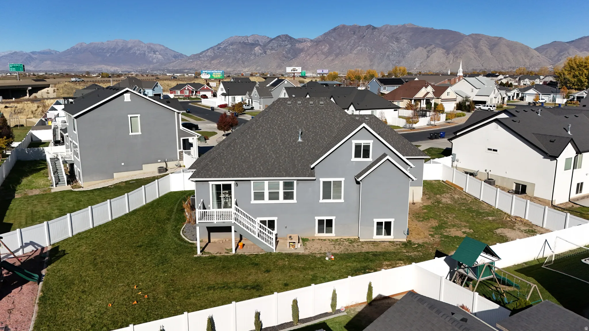 Aerial view of residential area featuring mountains