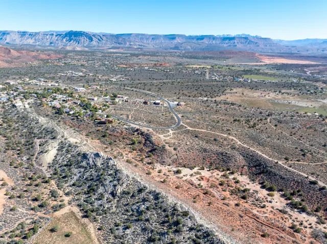 Aerial view of sparsely populated area with a mountain backdrop