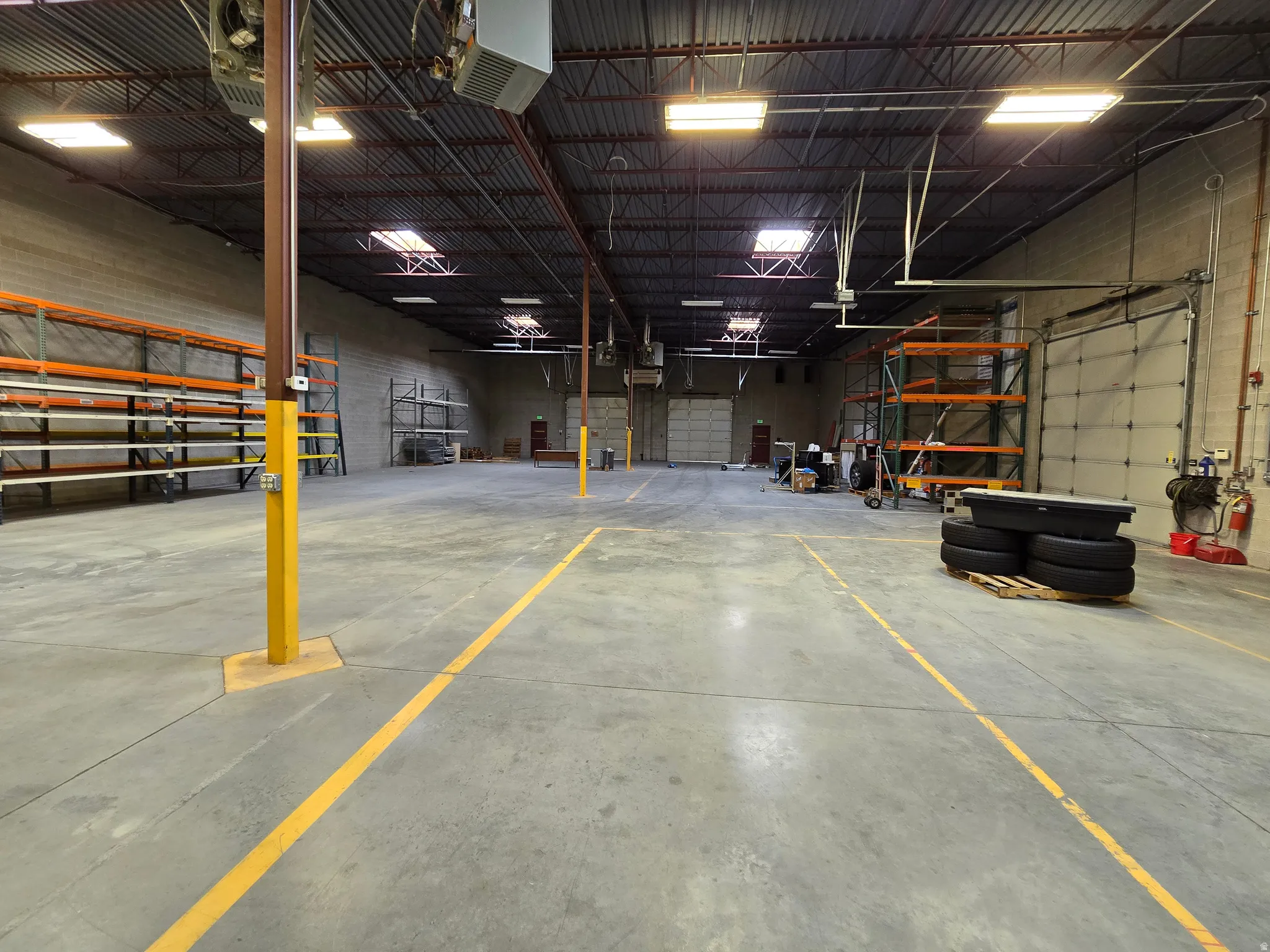 Garage featuring a heating unit