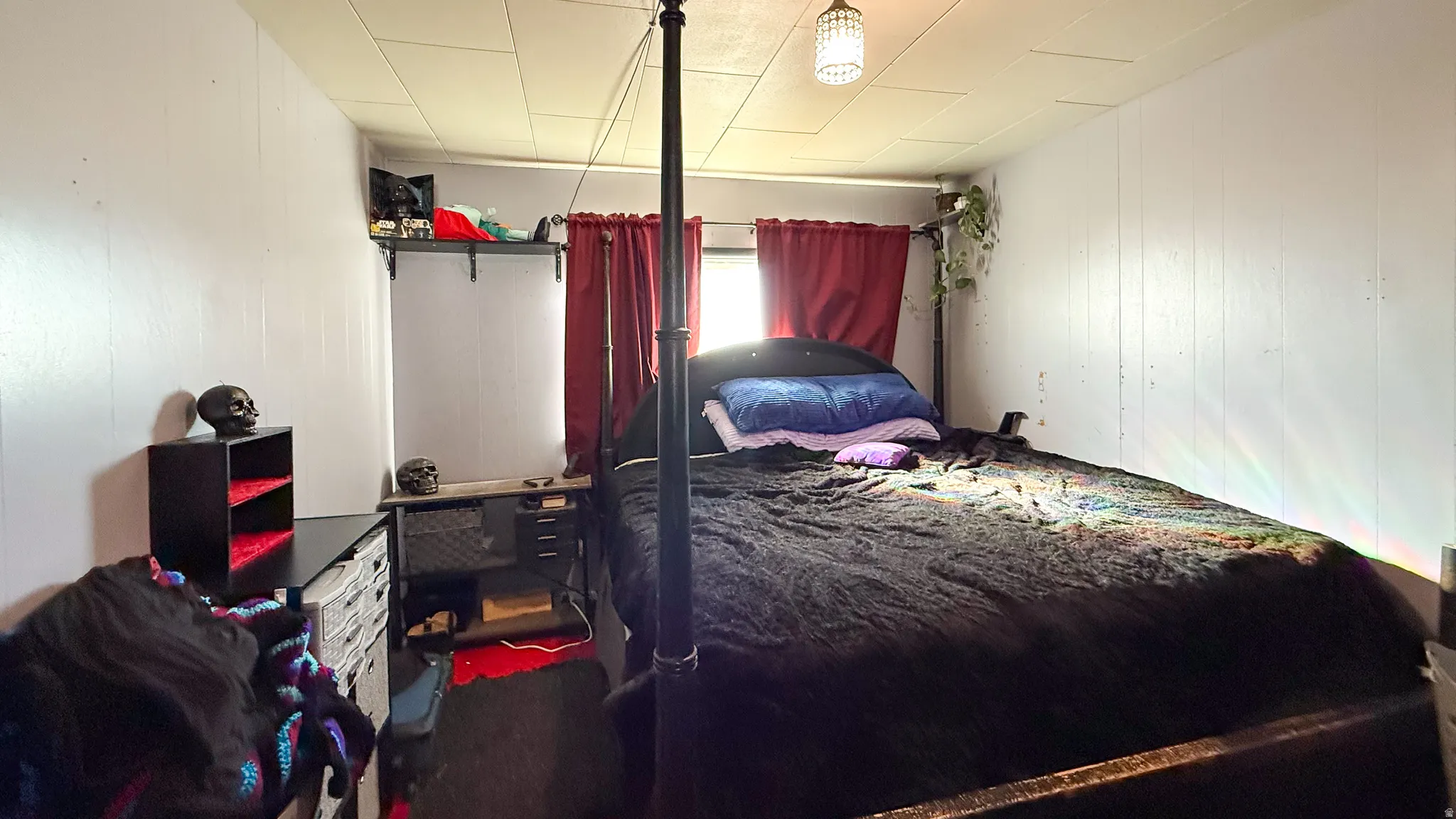 Bedroom with wooden walls