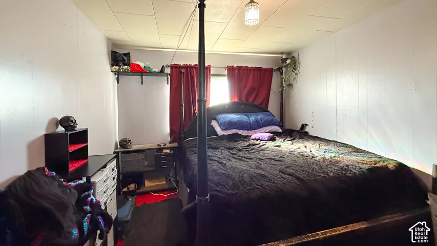 Bedroom with wooden walls