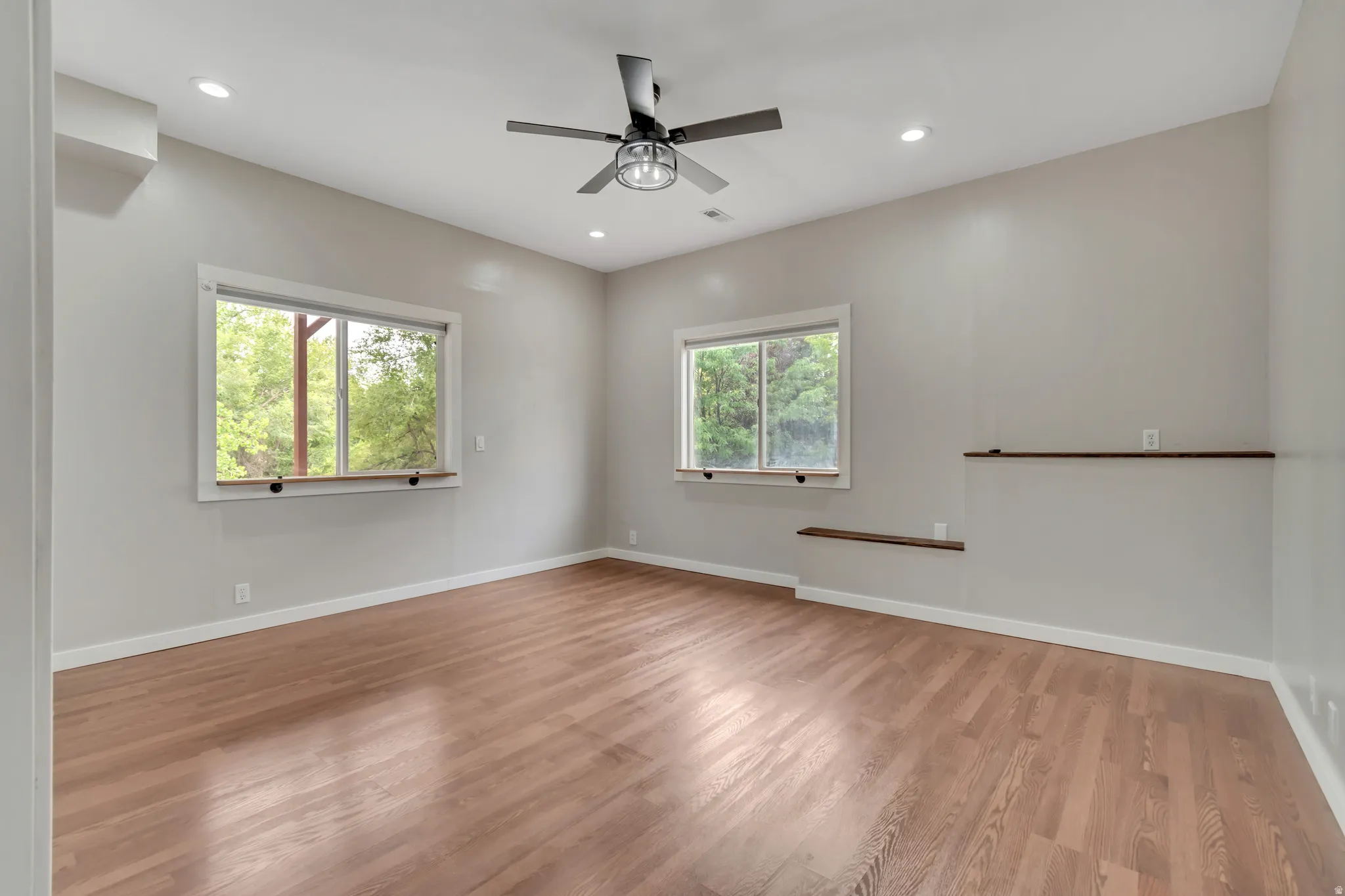 Unfurnished room with light wood finished floors, recessed lighting, and ceiling fan