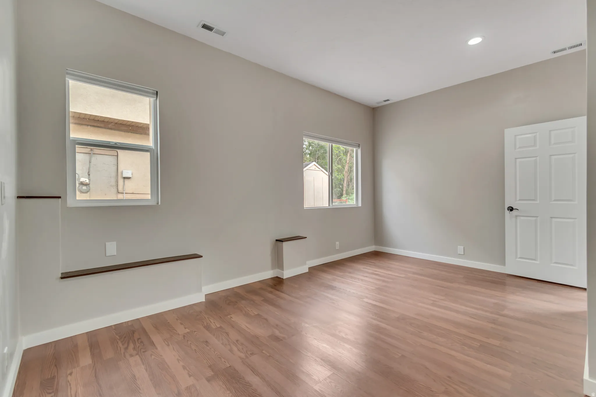 Spare room featuring light wood-style floors and recessed lighting