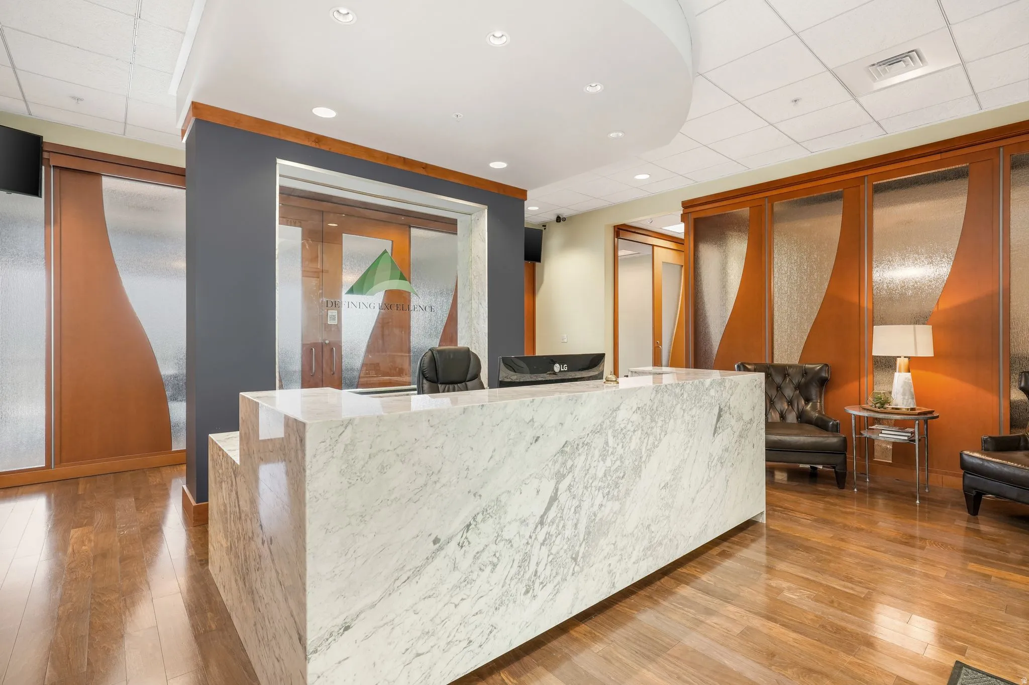 Reception area with recessed lighting and a paneled ceiling