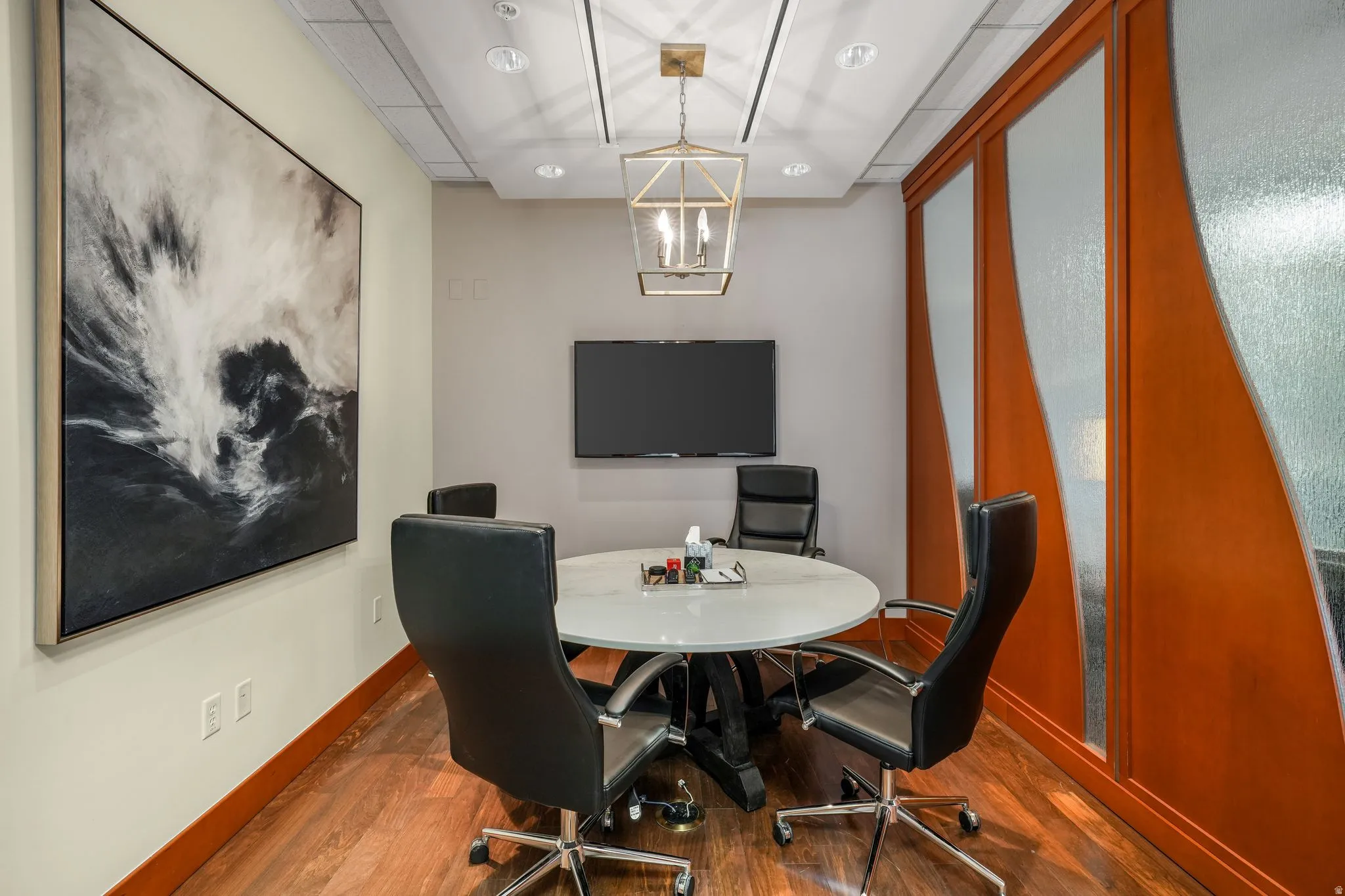 Office space featuring a chandelier and recessed lighting