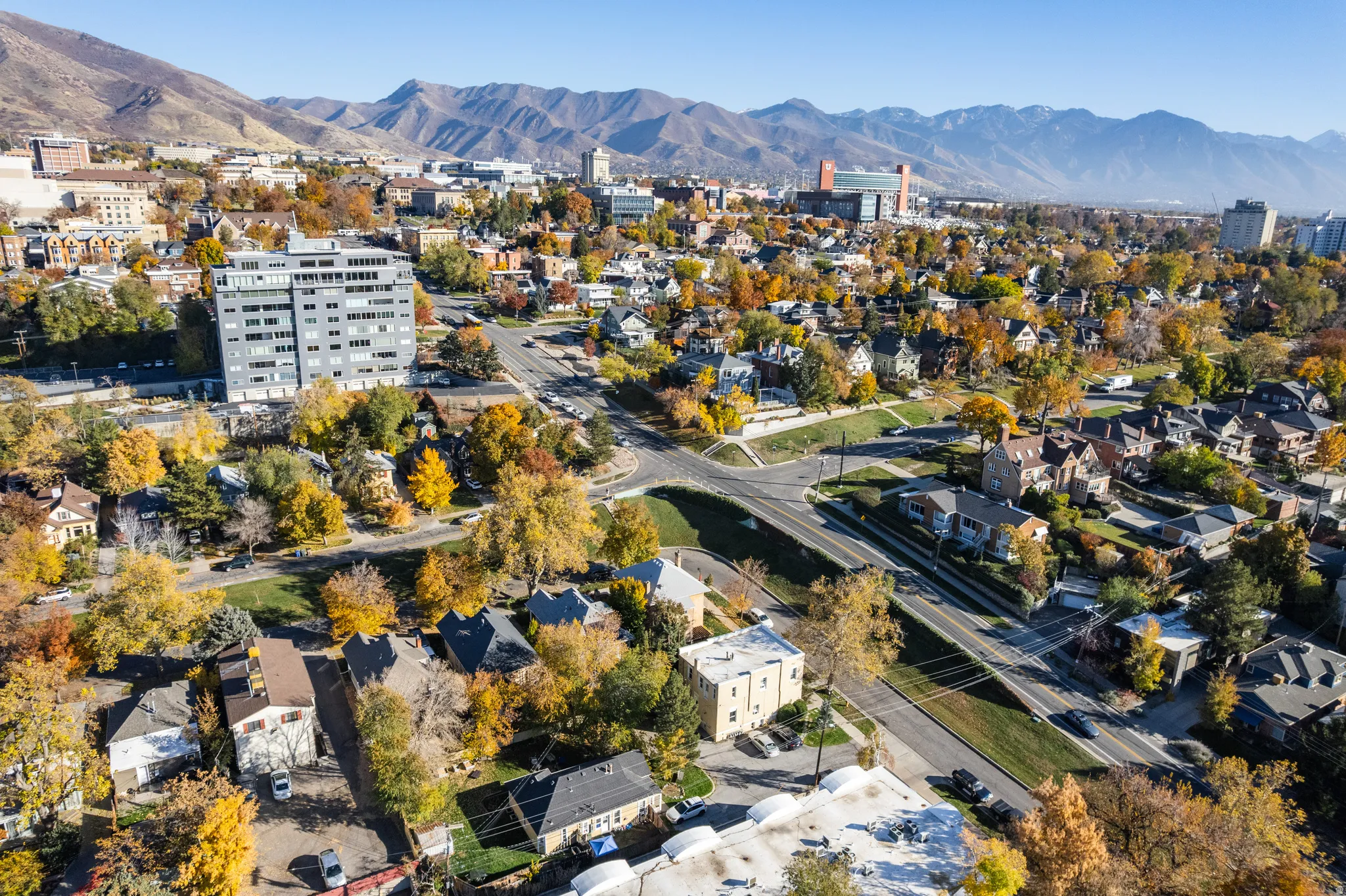Aerial overview of property's location featuring mountains and nearby suburban area