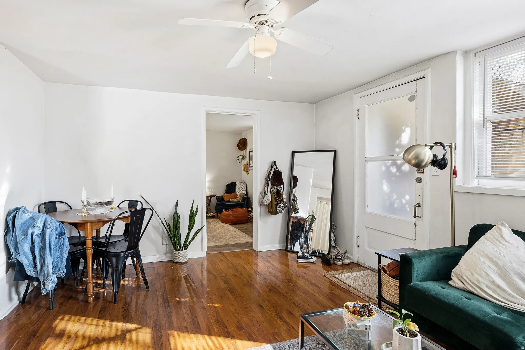 Living room with wood finished floors and ceiling fan