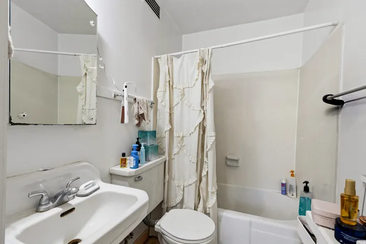 Full bath with shower / bath combo and toilet