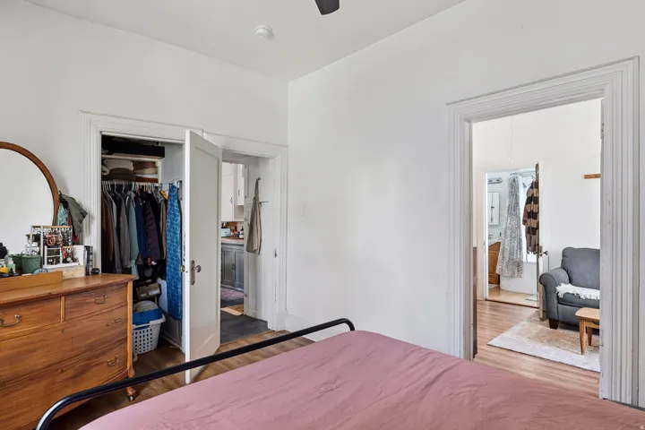 Bedroom featuring wood finished floors and a ceiling fan