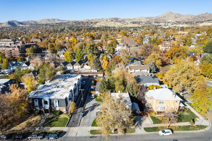 Aerial perspective of suburban area with a mountainous background