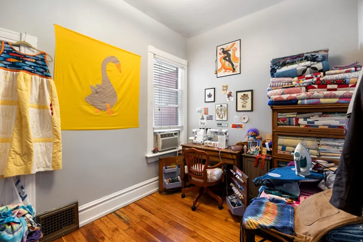 Office area featuring hardwood / wood-style flooring and cooling unit