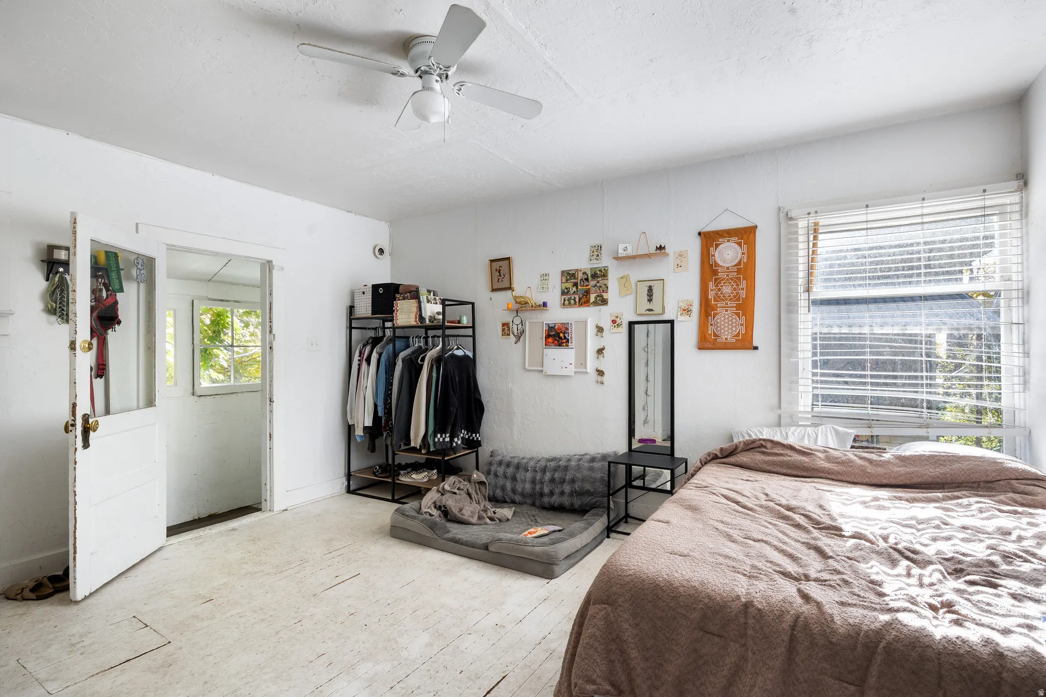 Bedroom with a ceiling fan and hardwood / wood-style flooring