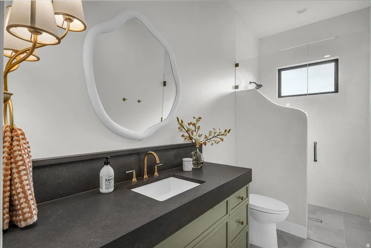 Bathroom with vanity and a shower stall