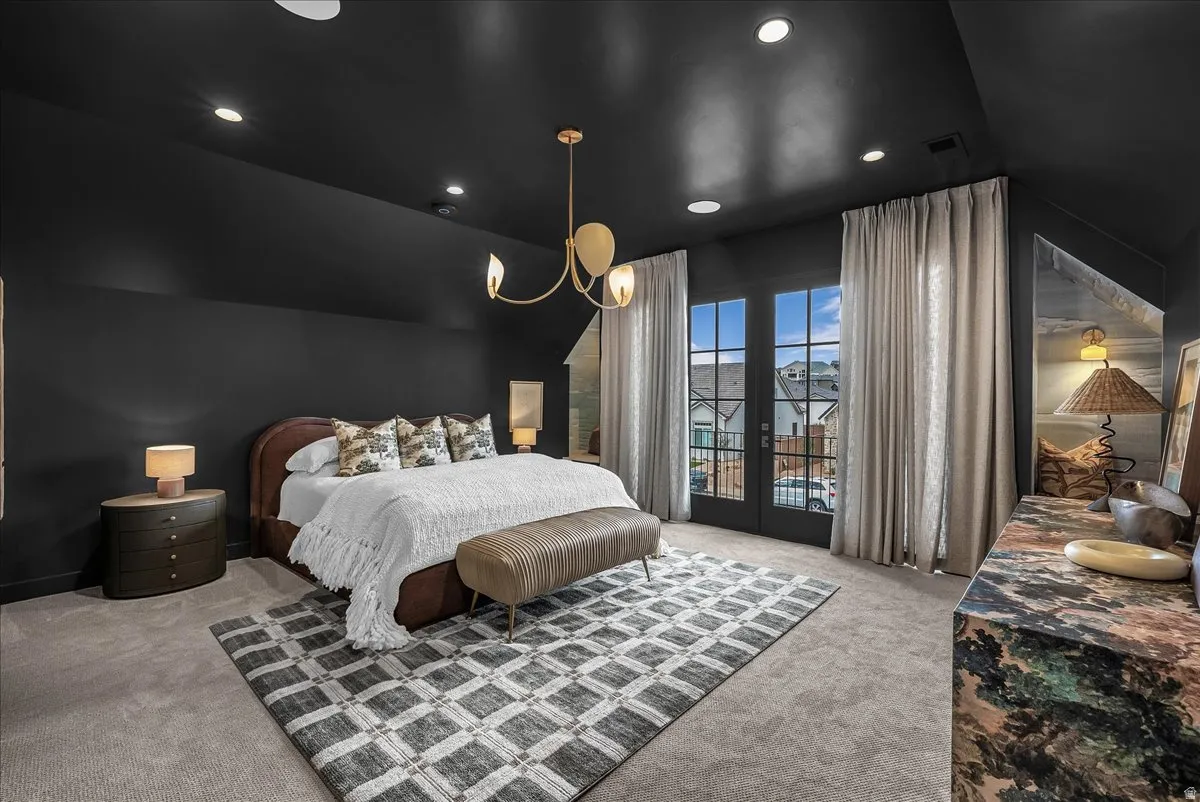 Bedroom featuring light carpet, french doors, access to outside, vaulted ceiling, and recessed lighting