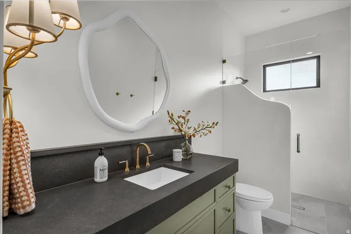 Bathroom with vanity and a shower stall