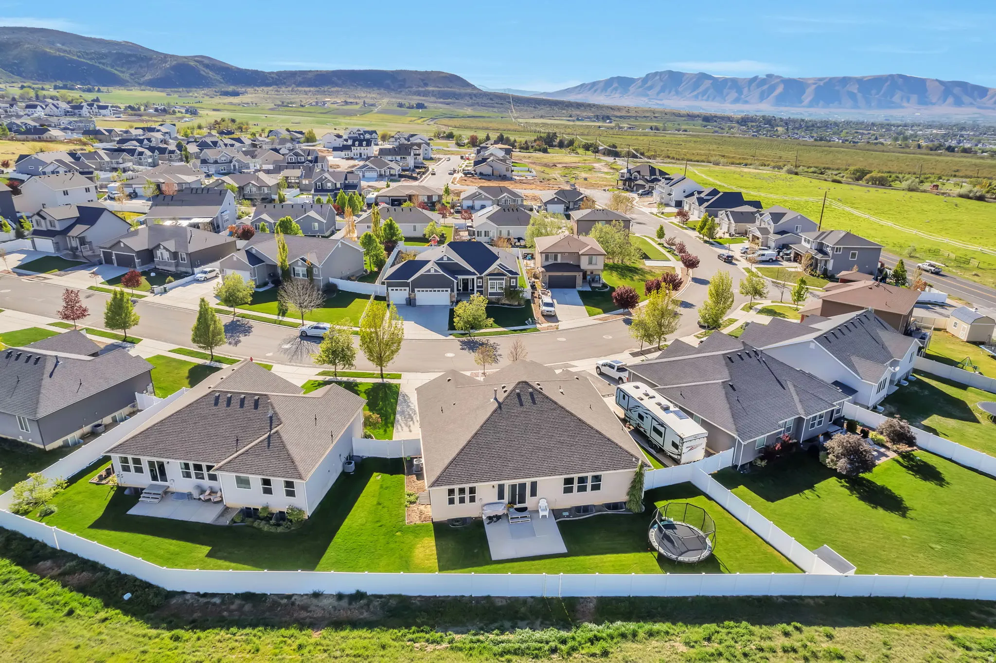 Aerial view of residential area featuring a mountainous background