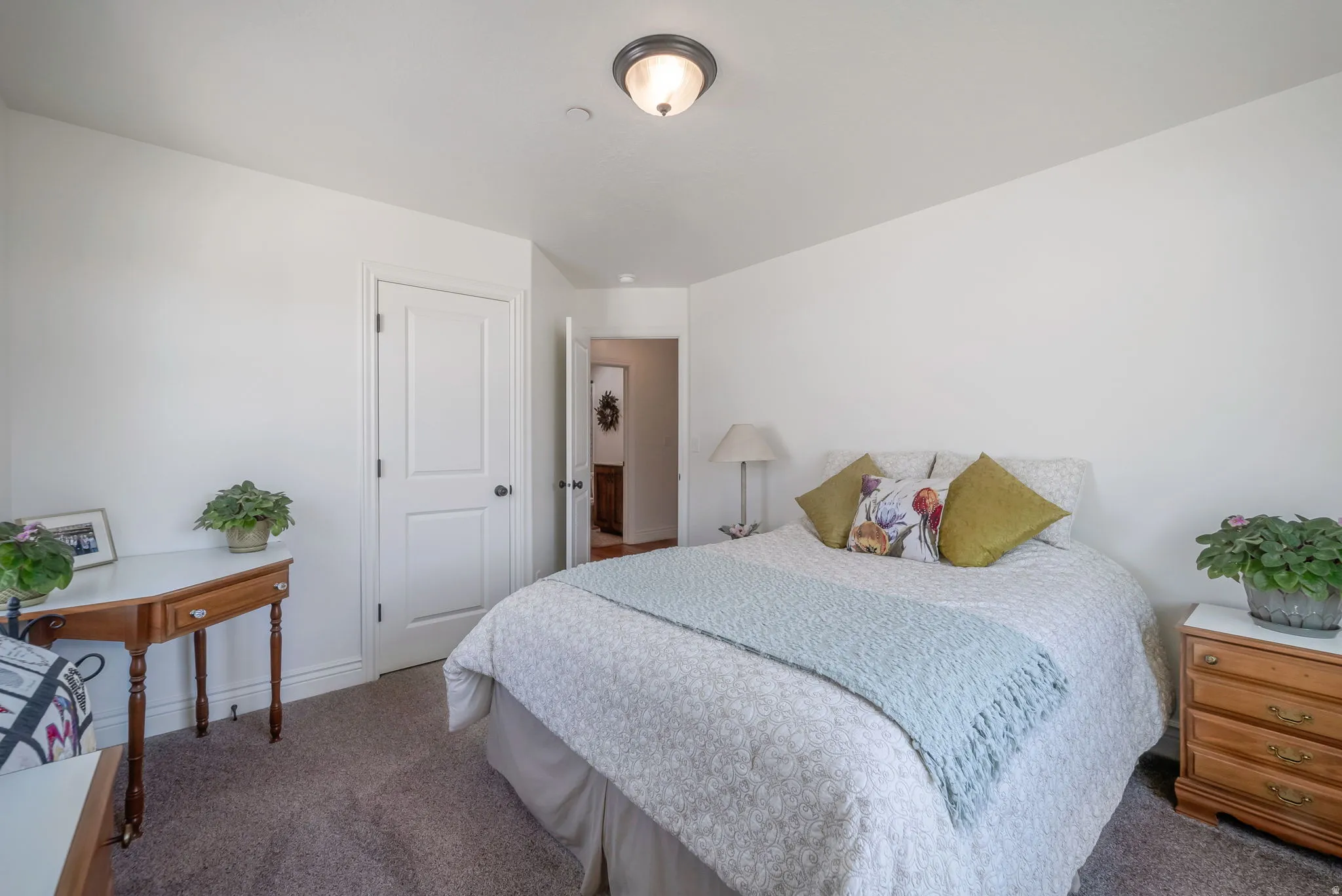 Carpeted bedroom with baseboards