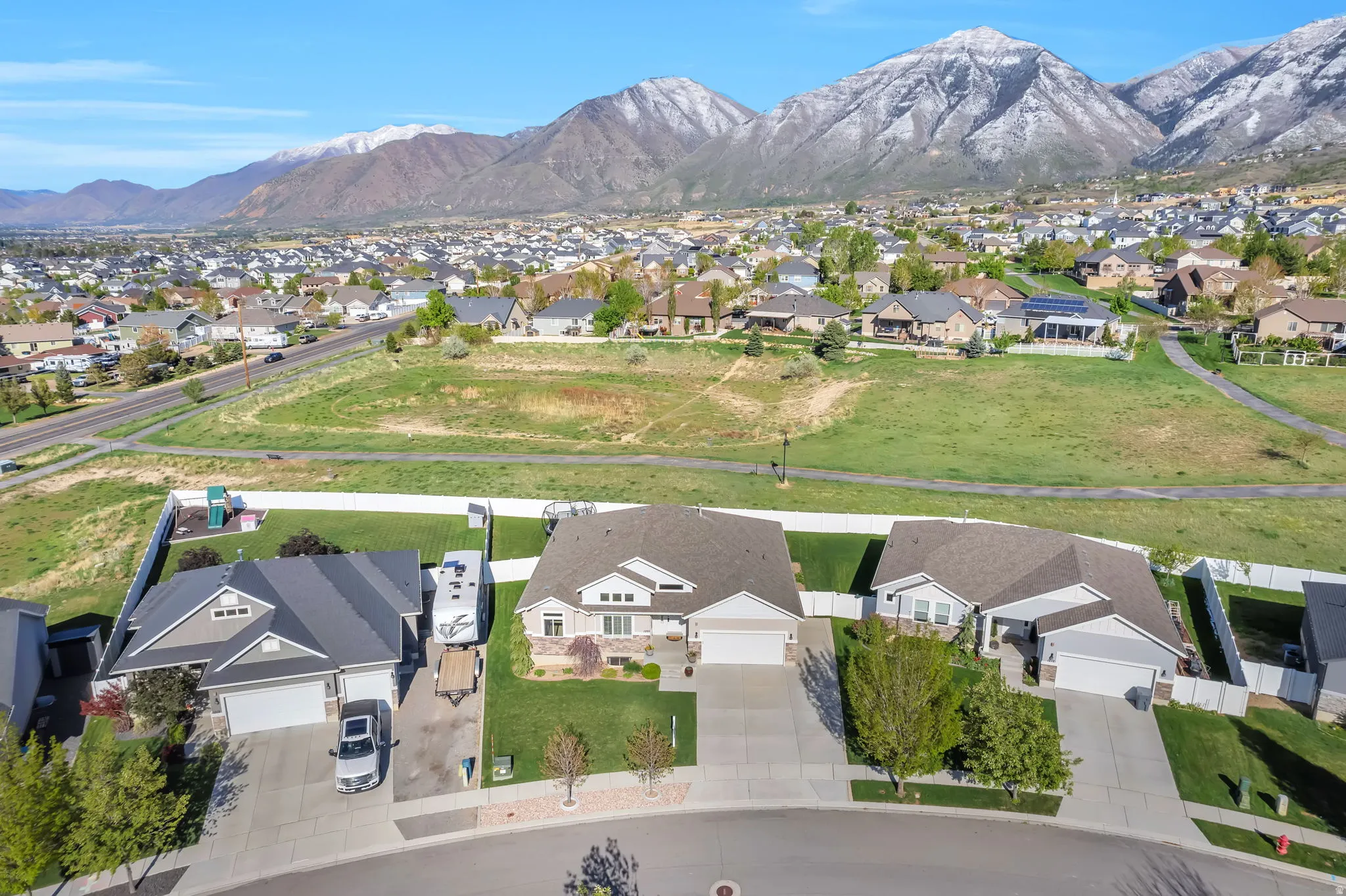 Aerial view of residential area featuring a mountainous background
