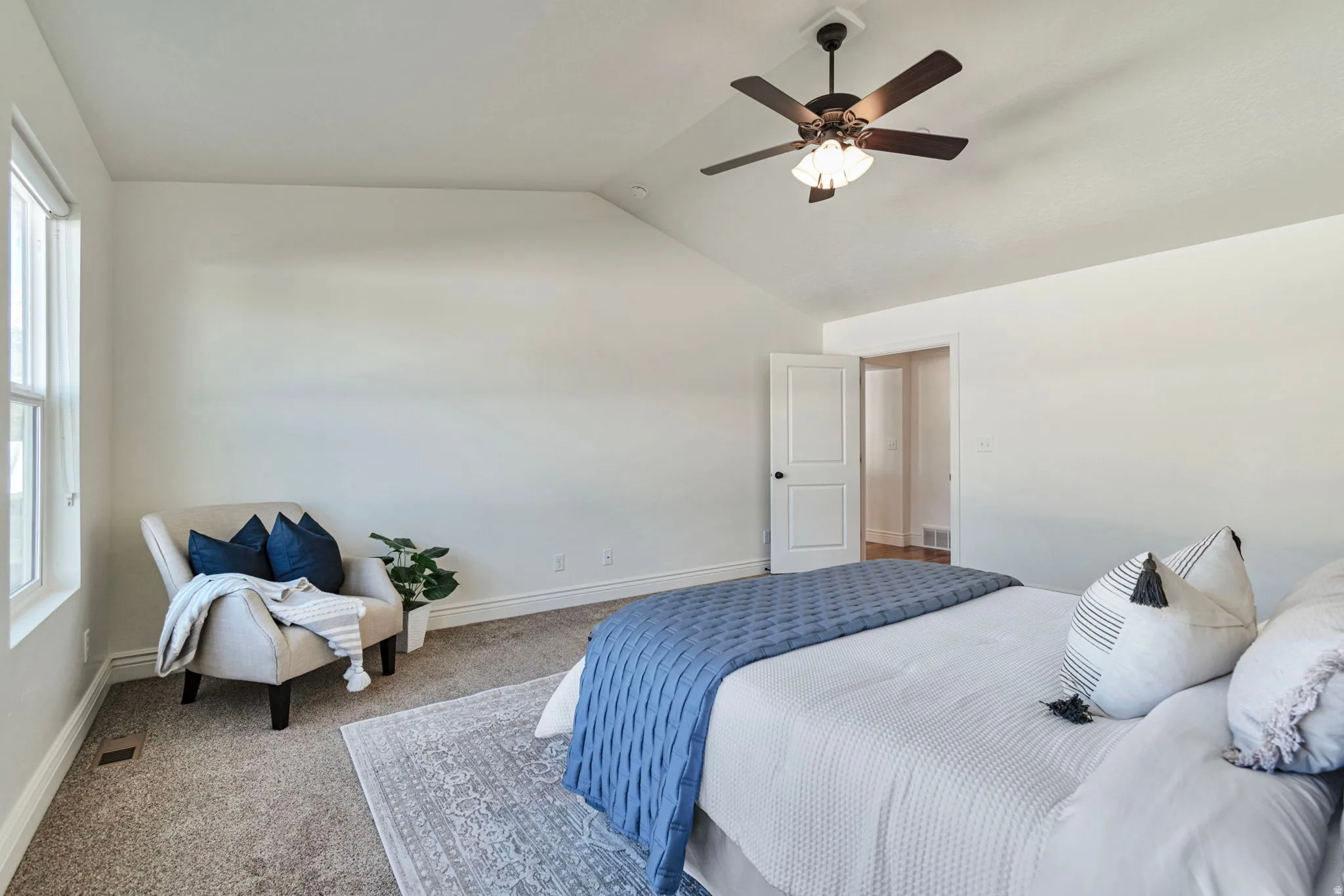 Bedroom featuring carpet flooring and ceiling fan