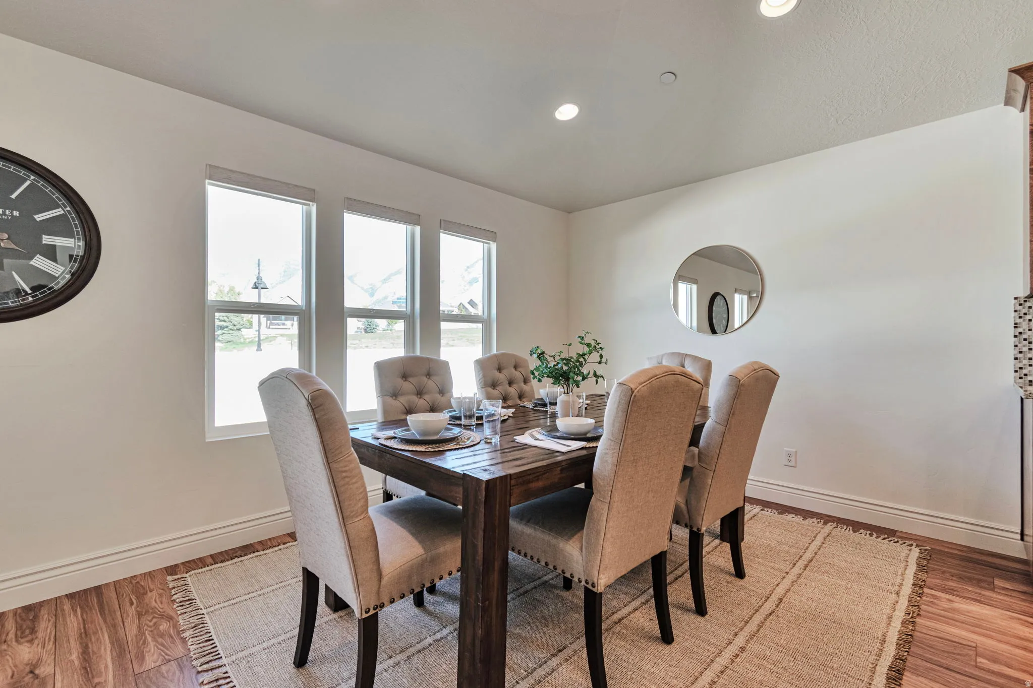 Dining room featuring light wood-type flooring and recessed lighting