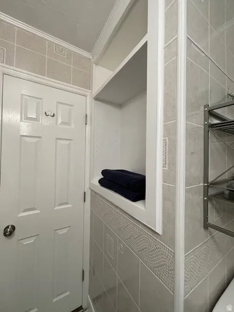 Mudroom featuring ornamental molding