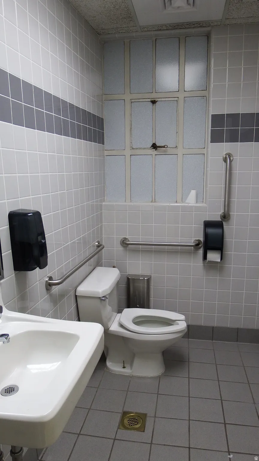 Half bathroom with tile walls and tile patterned floors