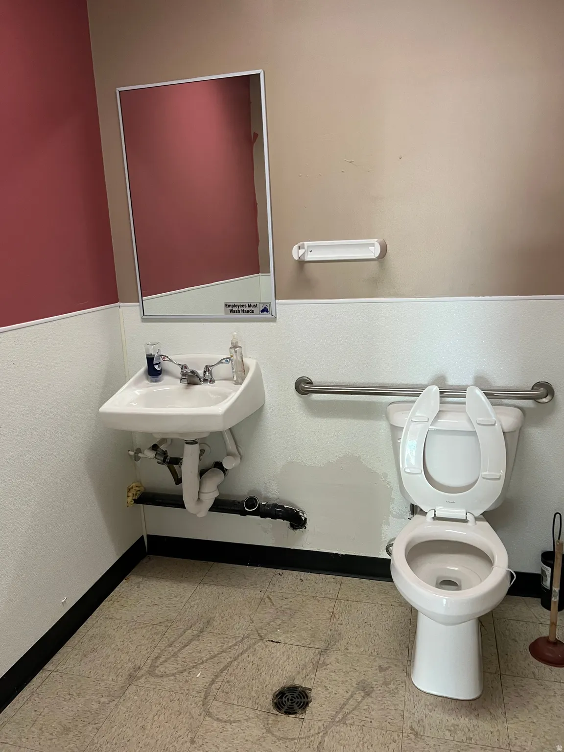Bathroom with baseboards and toilet