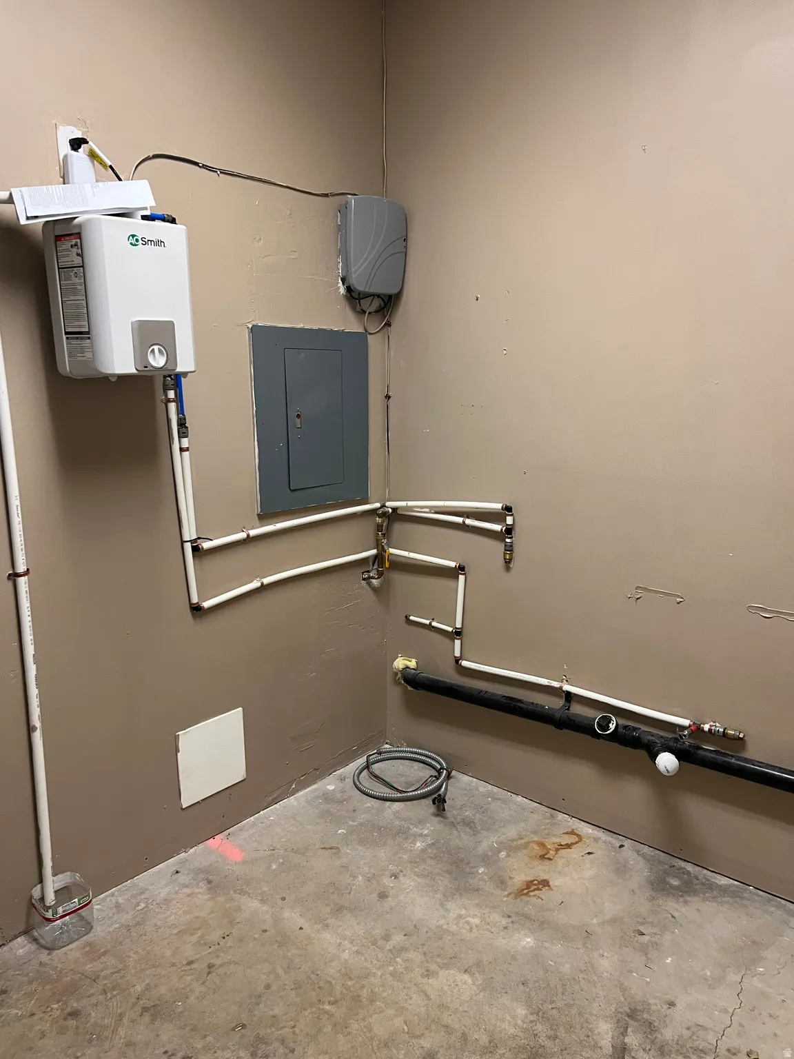 Bathroom featuring concrete flooring and electric panel