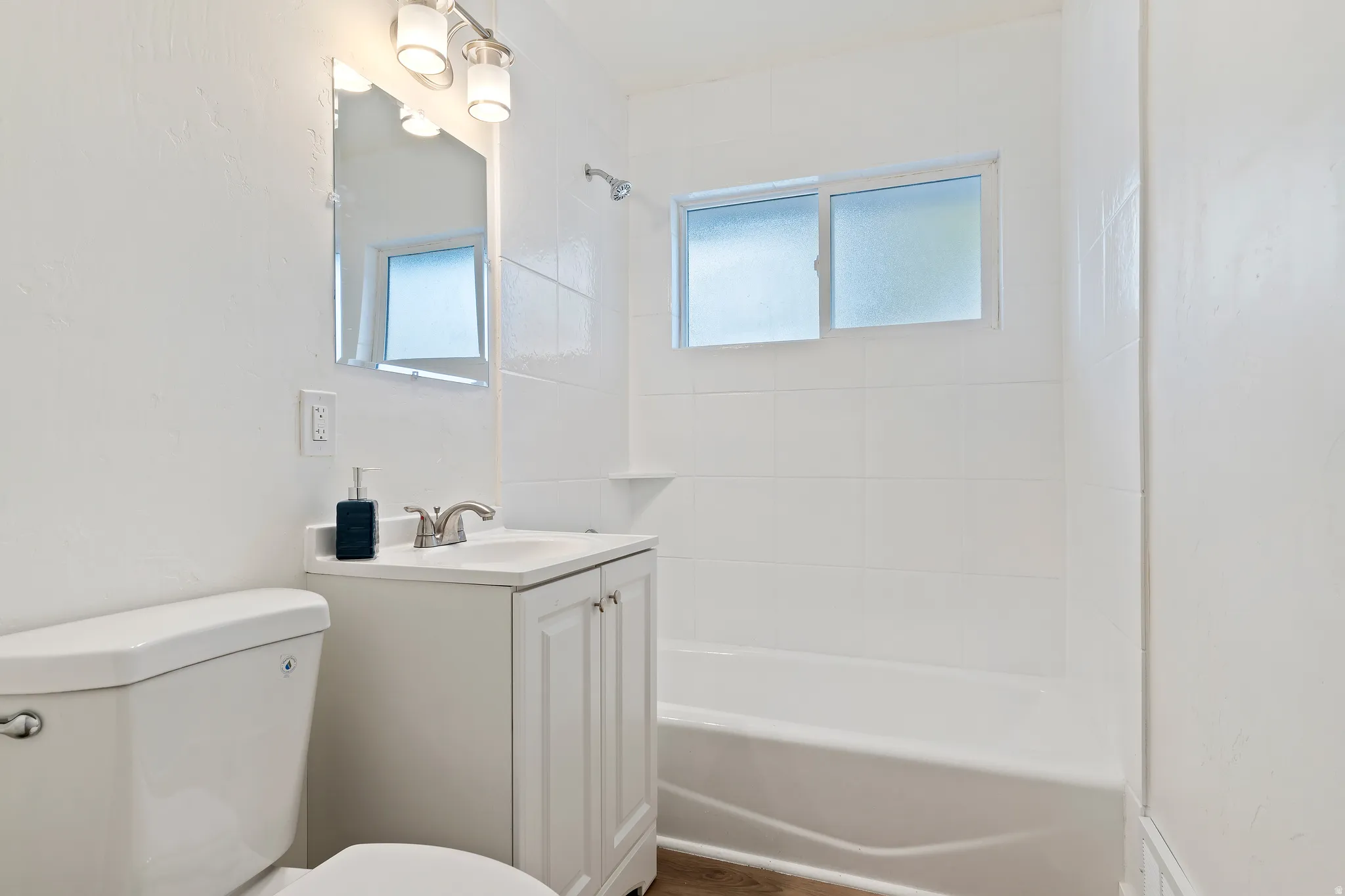 Unit 2 Full bath with vanity and bathtub / shower combination