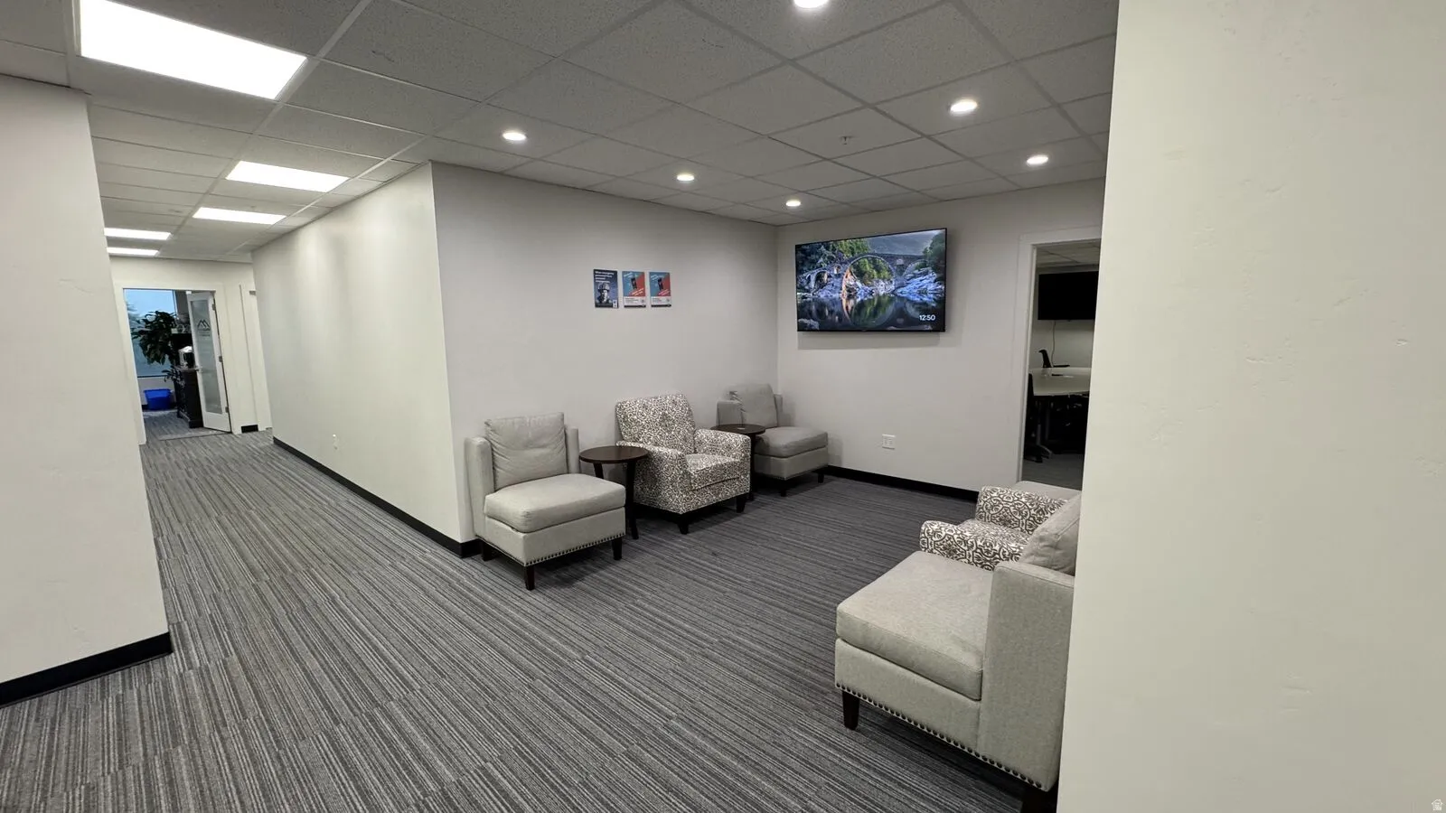 Common area with a paneled ceiling and recessed lighting