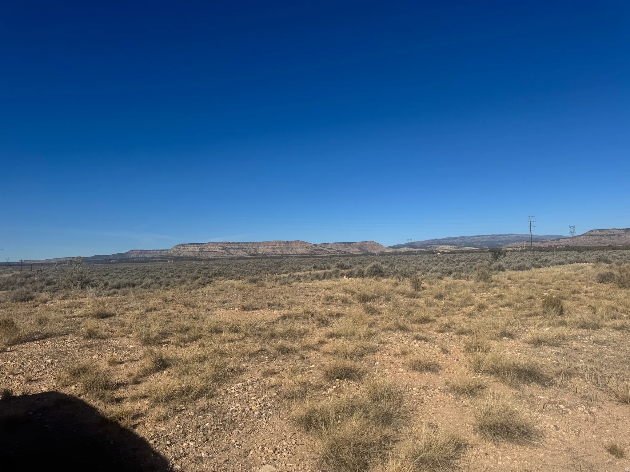 View of mountain backdrop featuring rural landscape