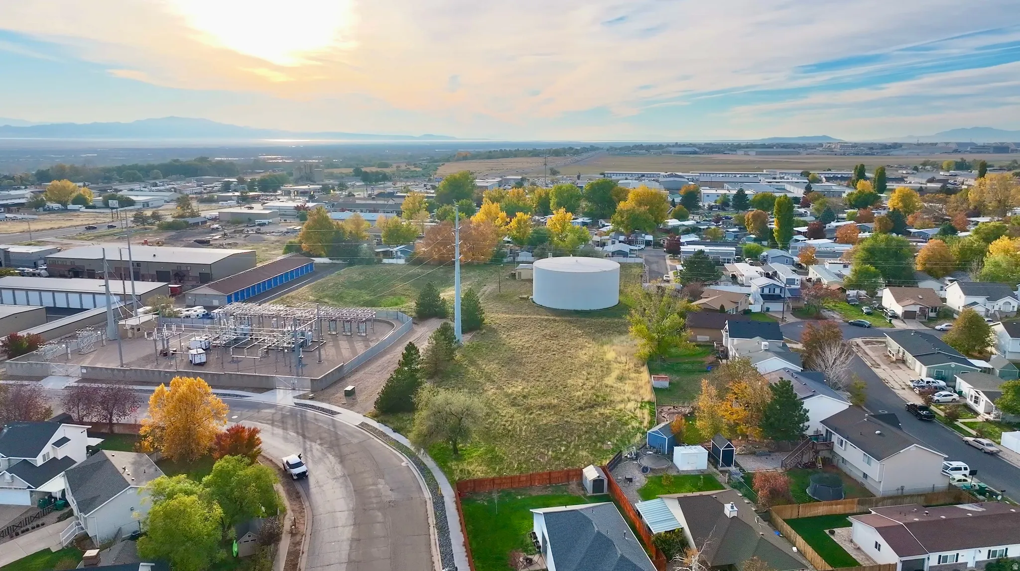 Aerial perspective of suburban area featuring a mountain backdrop