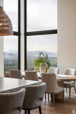 Example of dining room featuring wood finished floors and a mountain view
