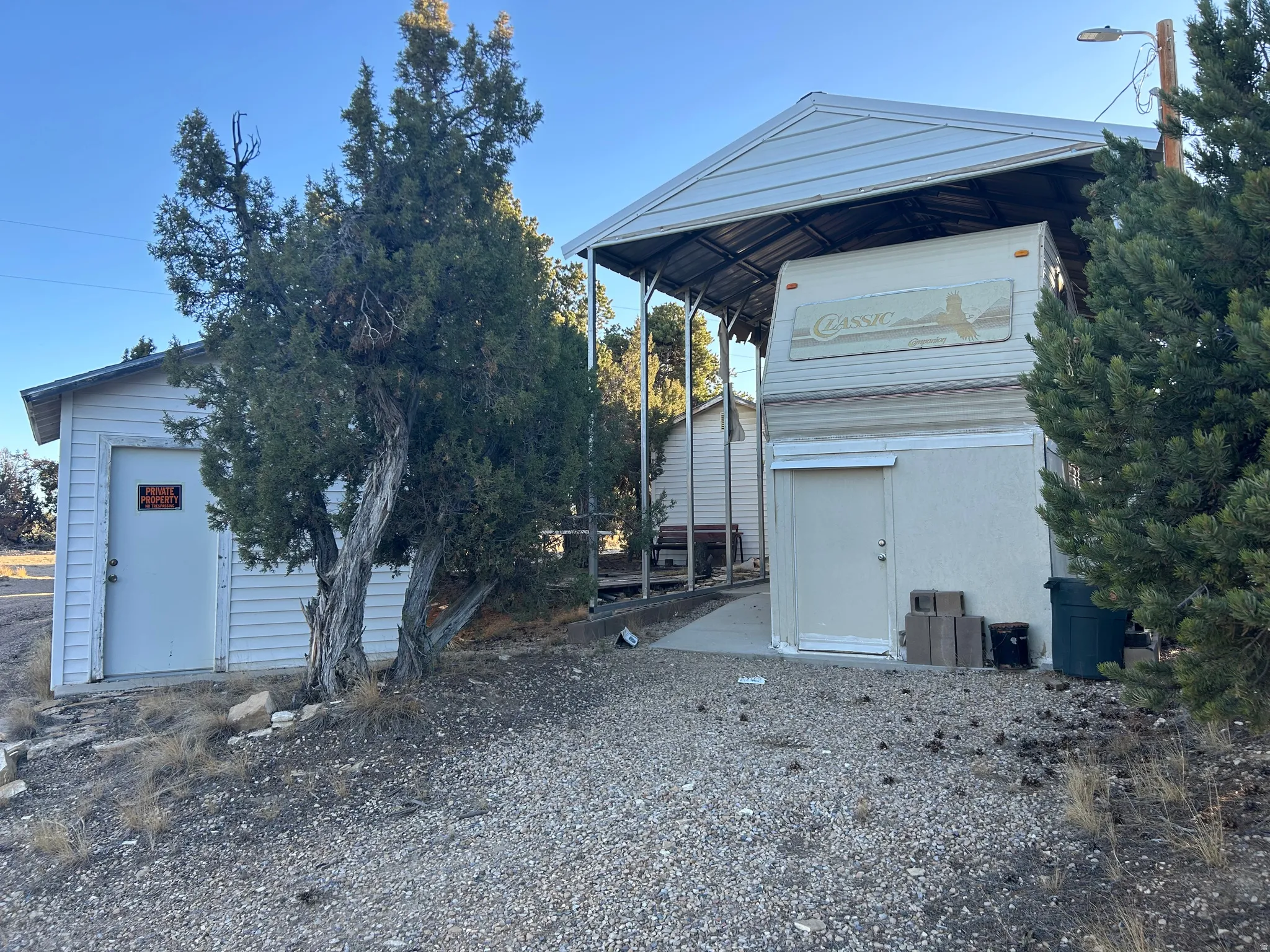 View of front of property featuring an outbuilding
