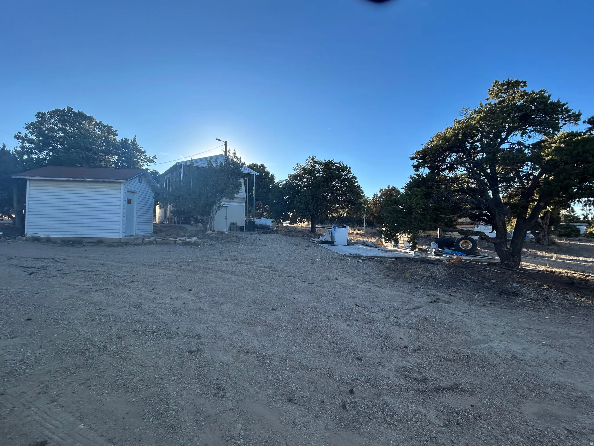 View of yard with a storage unit