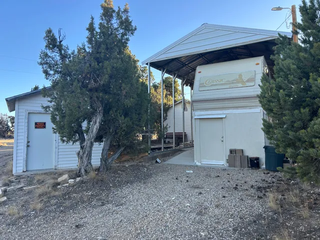 View of front of property featuring an outbuilding