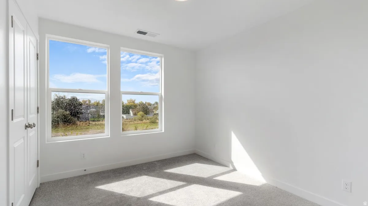 Unfurnished room featuring carpet