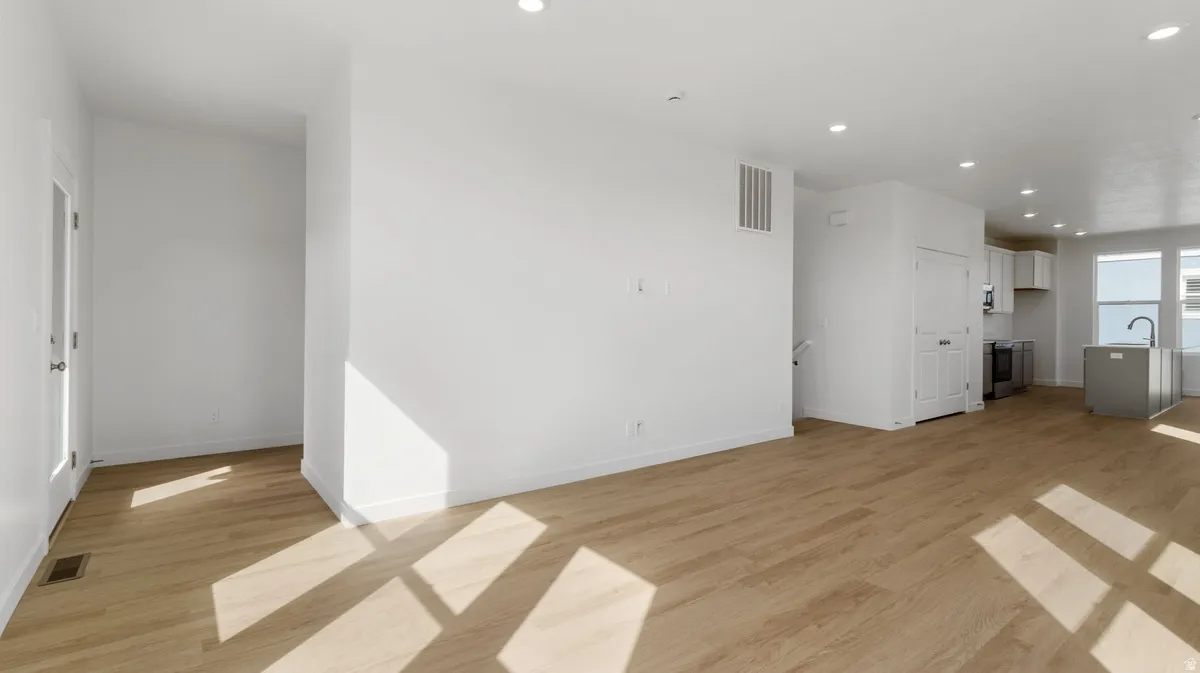 Unfurnished living room featuring recessed lighting and light wood-type flooring