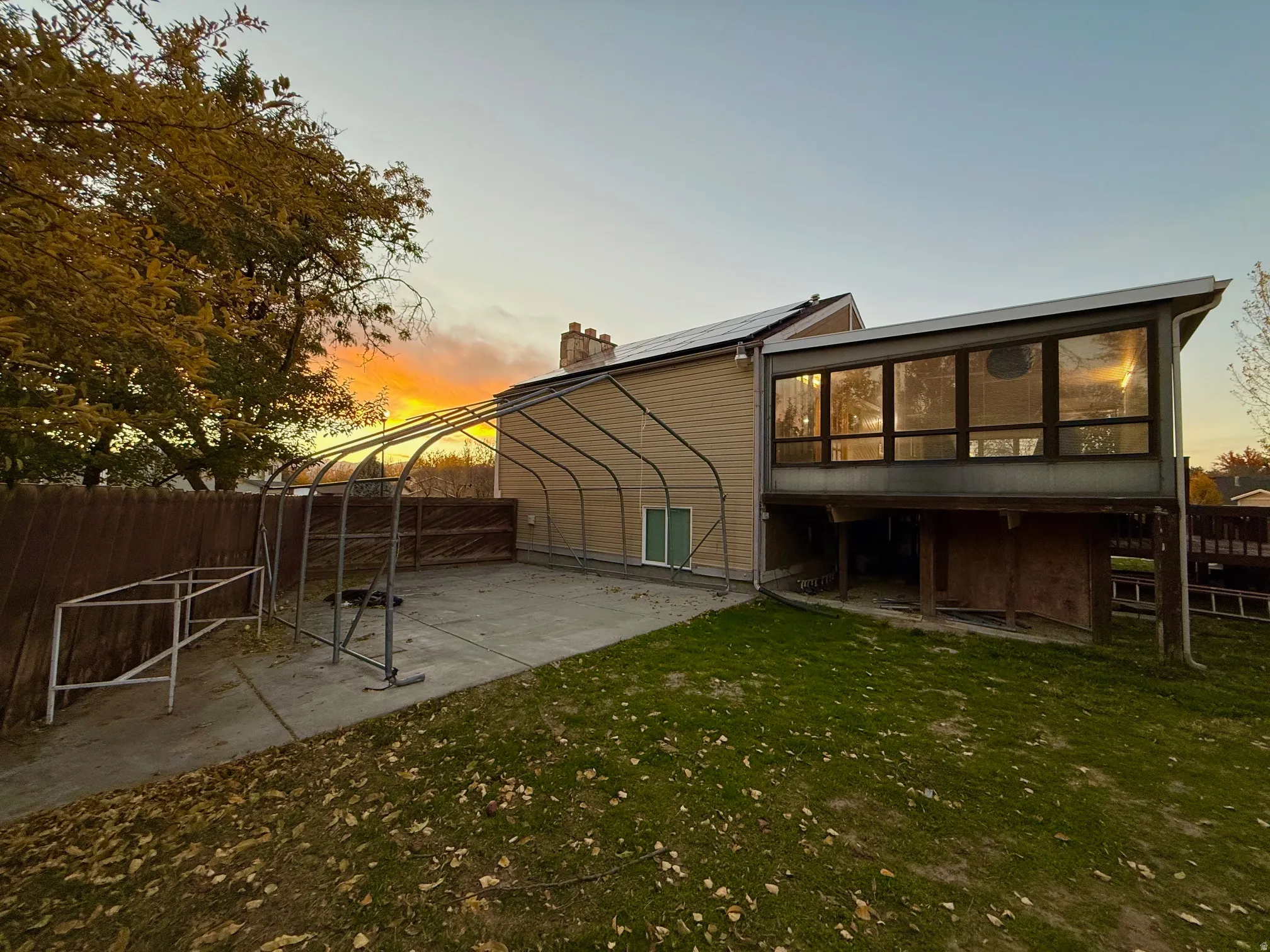 Back of property with a patio area and a chimney