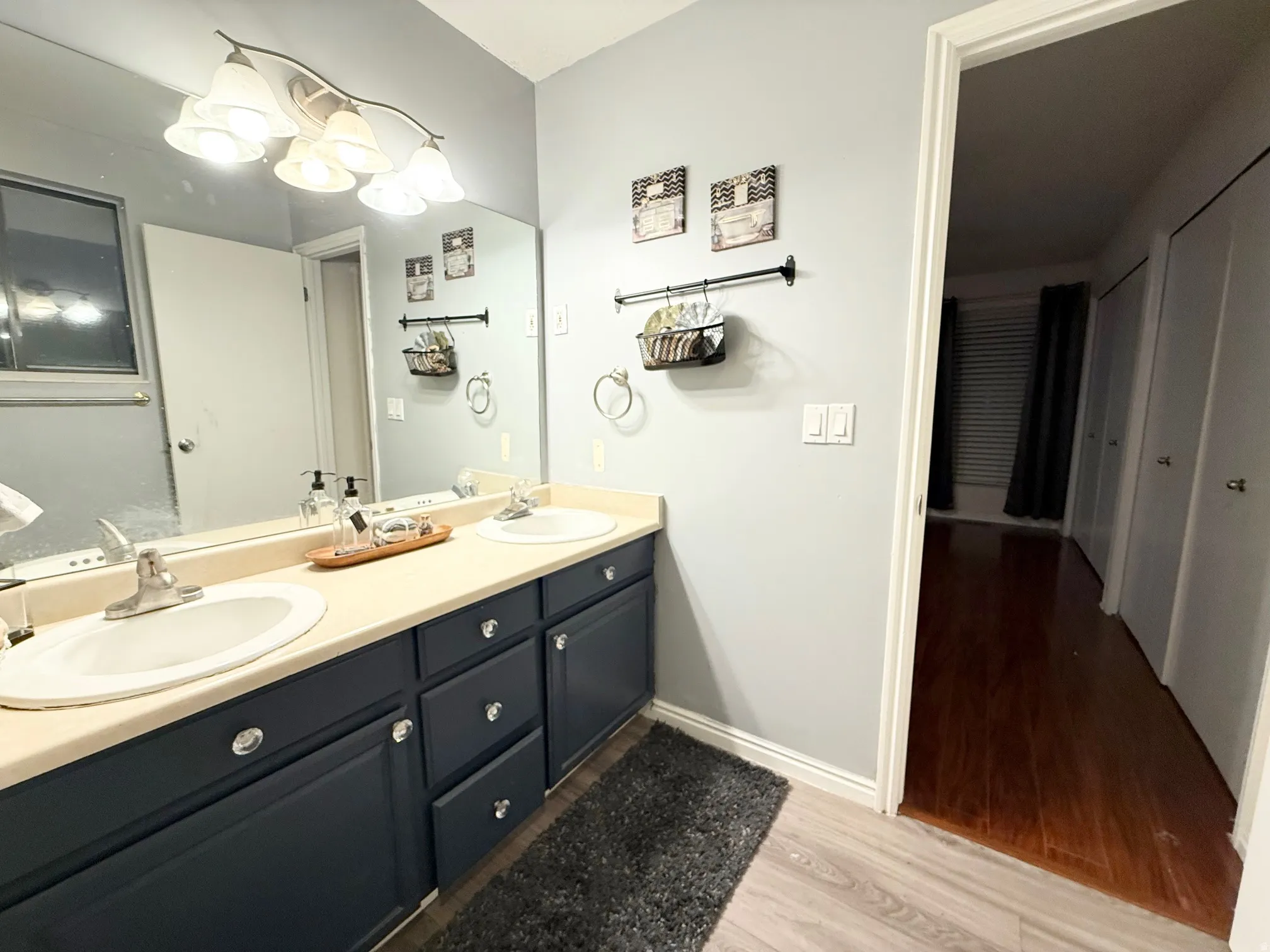 Bathroom featuring light wood-style floors and double vanity
