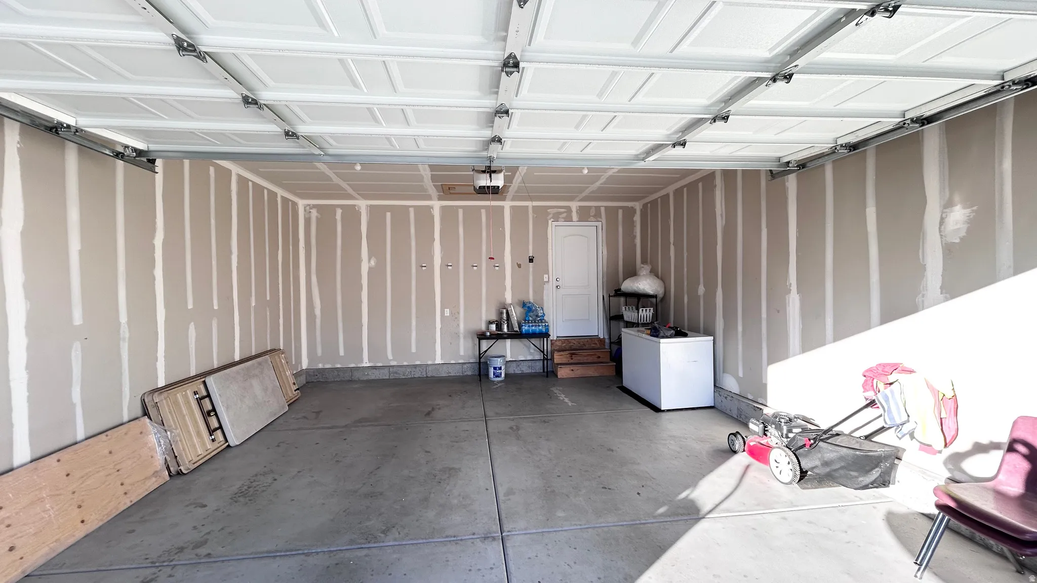 Garage with white fridge