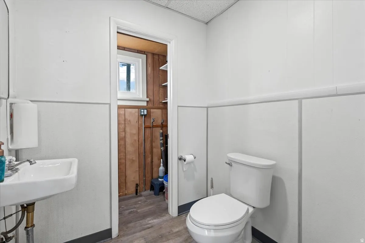 Bathroom with wood finished floors and toilet