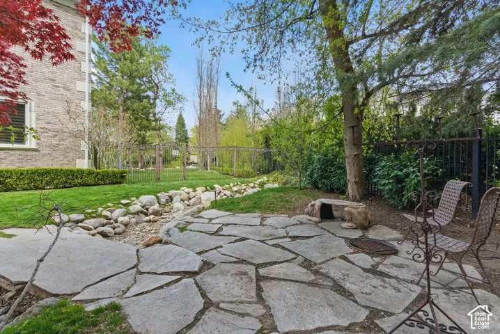 Fenced backyard with a patio area