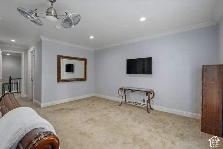 Unfurnished room featuring crown molding, light colored carpet, and recessed lighting