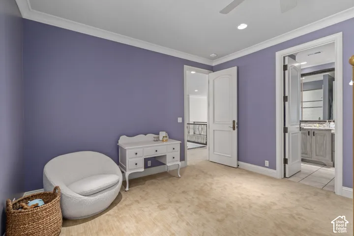 Sitting room with light carpet, ornamental molding, recessed lighting, and a ceiling fan